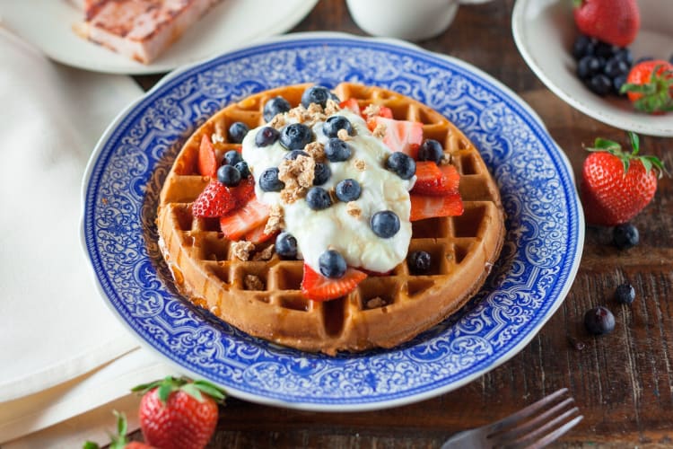 A round waffle with Greek yogurt and berries