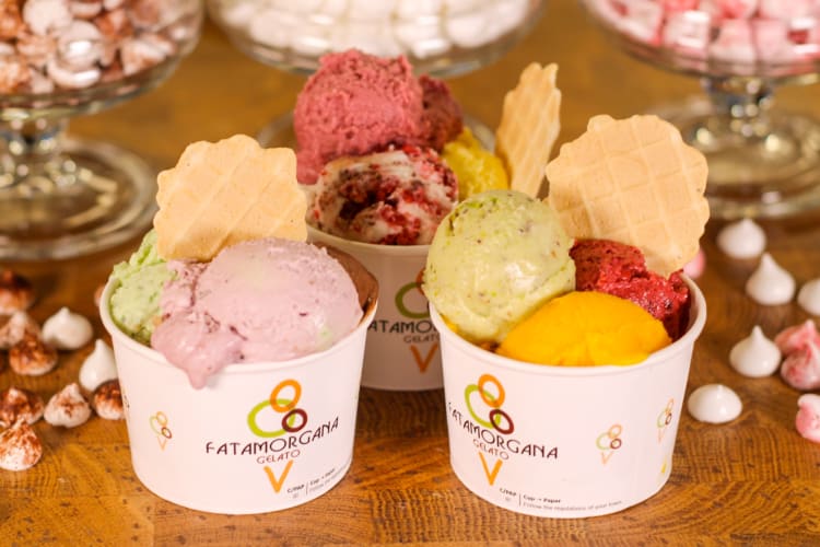 Three cups with different types of gelato