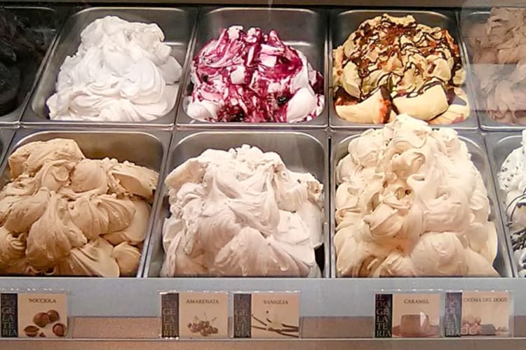 Different types of gelato in a display case
