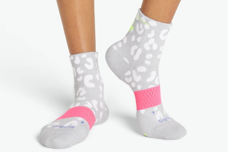 White and grey animal print socks with a pink band