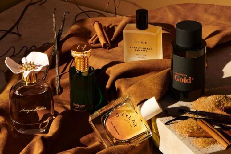 A collection of perfumes on a cloth