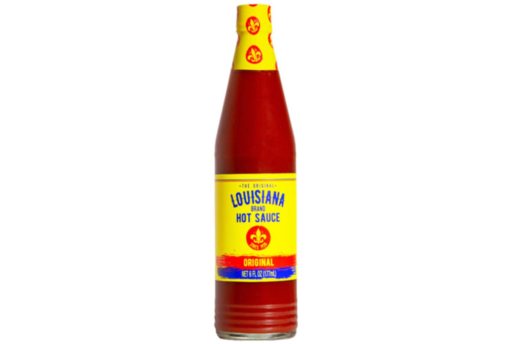 A bottle of Louisiana Hot Sauce with a yellow label
