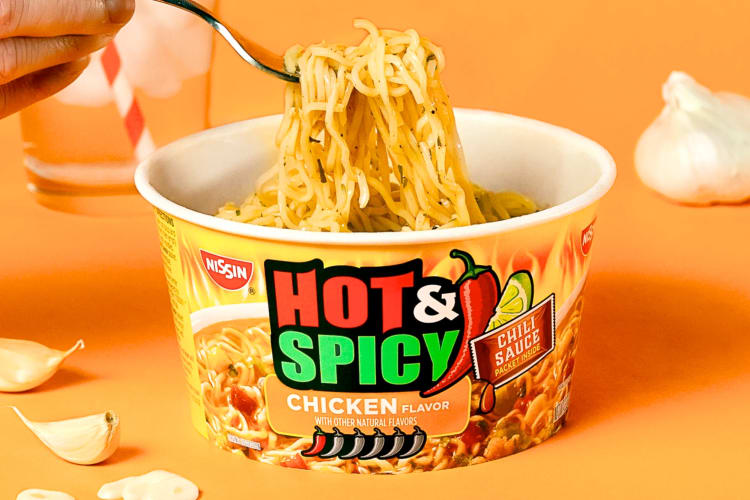 Noodles being eaten out of an instant ramen bowl