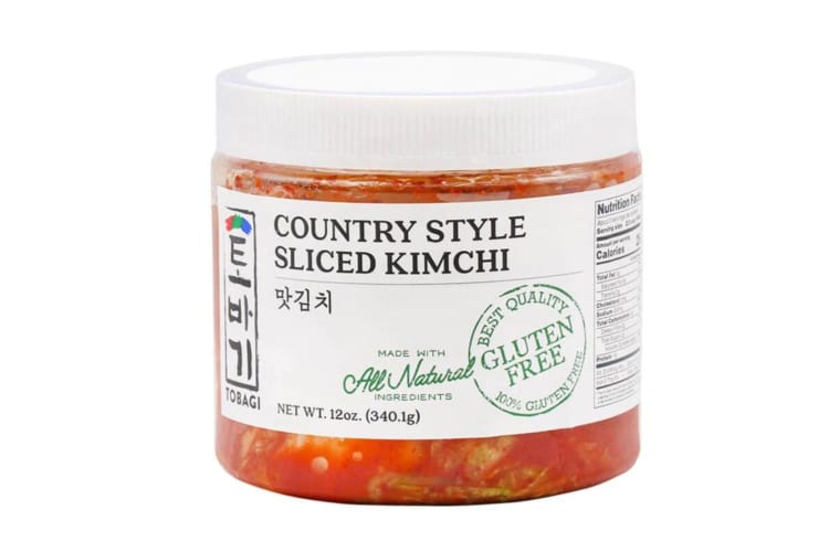 A plastic tub of kimchi