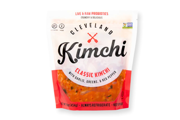 A red and white bag of kimchi