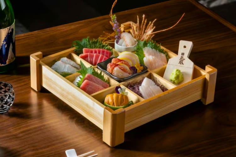 A selection of sashimi in a wooden box