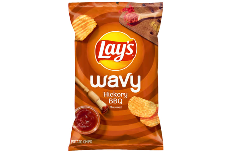 A bag of Lays Wavy chips in Hickory BBQ flavor