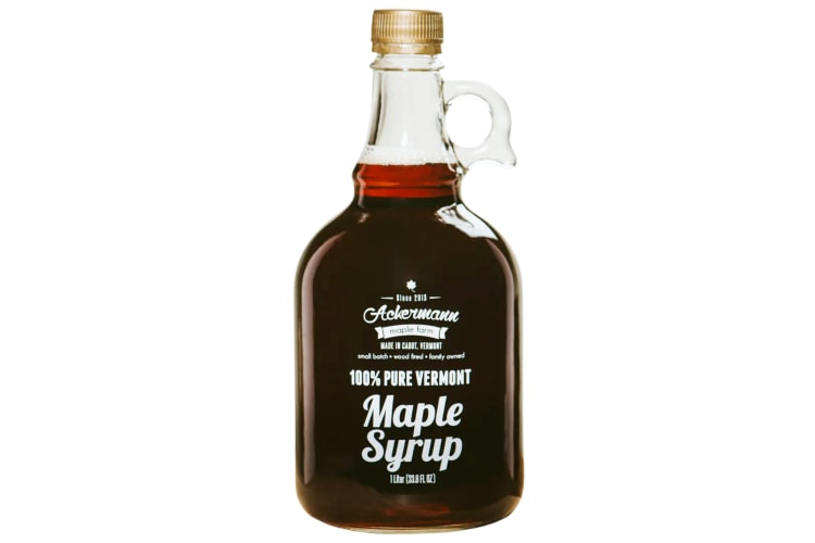 A glass jug of maple syrup
