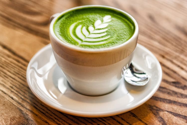A matcha latte with leaf latte art