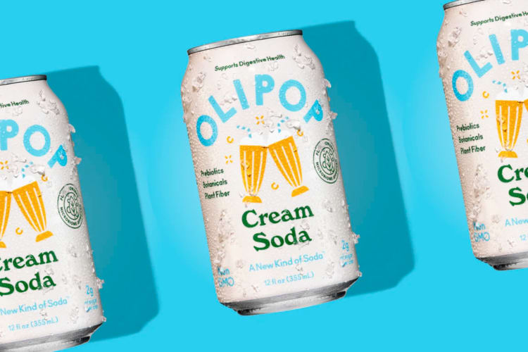 Cans of cream soda on a blue background