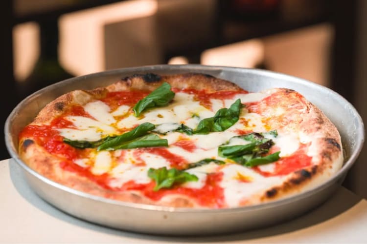 A Margherita in a pizza pan