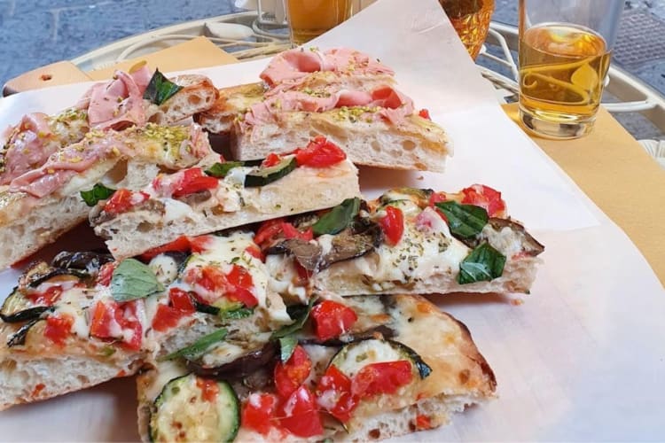 Square slices of pizza with various toppings