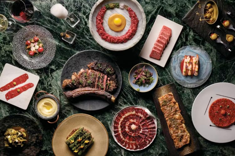 A selection of high-end meat dishes on a table