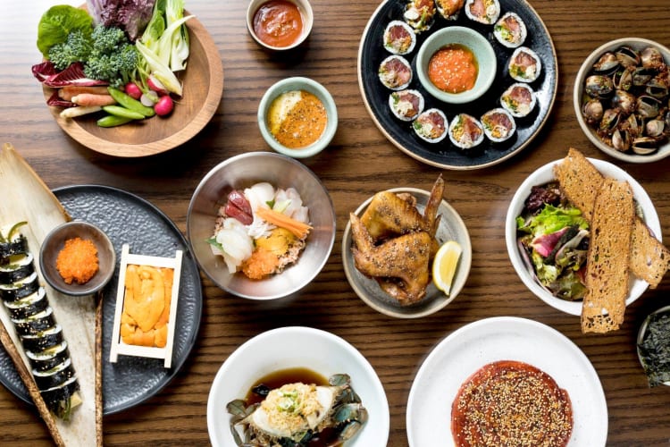 A selection of Asian-style dishes on a wooden table