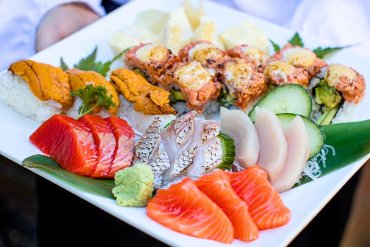 A selection of sushi and sashimi on a plate