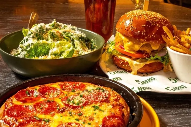 A burger, pizza and salad