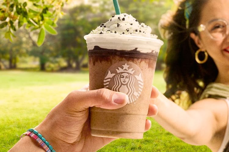 A person holding a Chocolate Java Mint Frappuccino