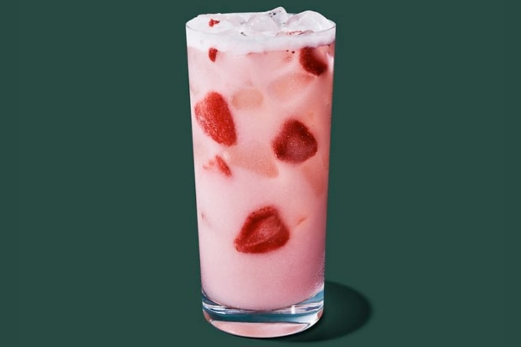 A pink drink with fresh strawberries