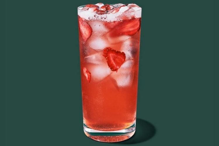 A strawberry drink with fresh strawberries