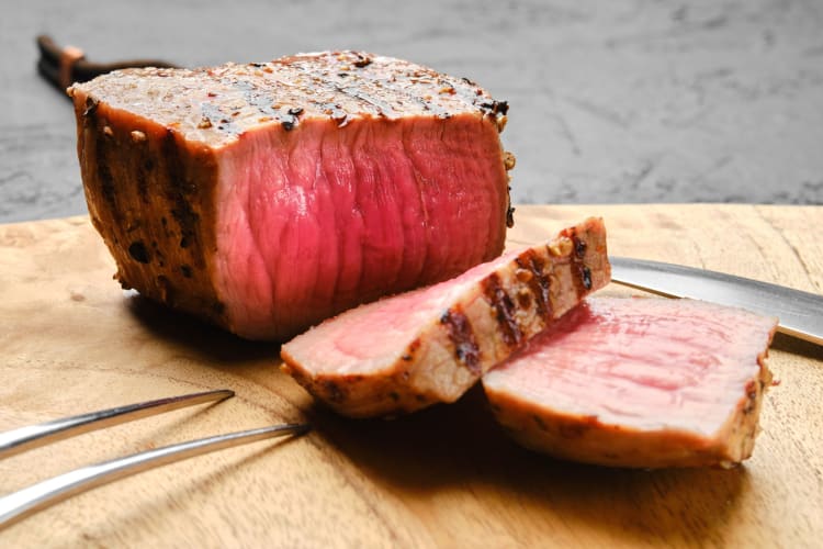 A medium-rare roasted joint of beef.