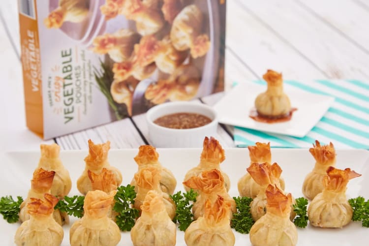 Vegetable pastry pouches on a plate with the box in the background