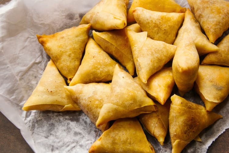 Mini samosas on parchment 