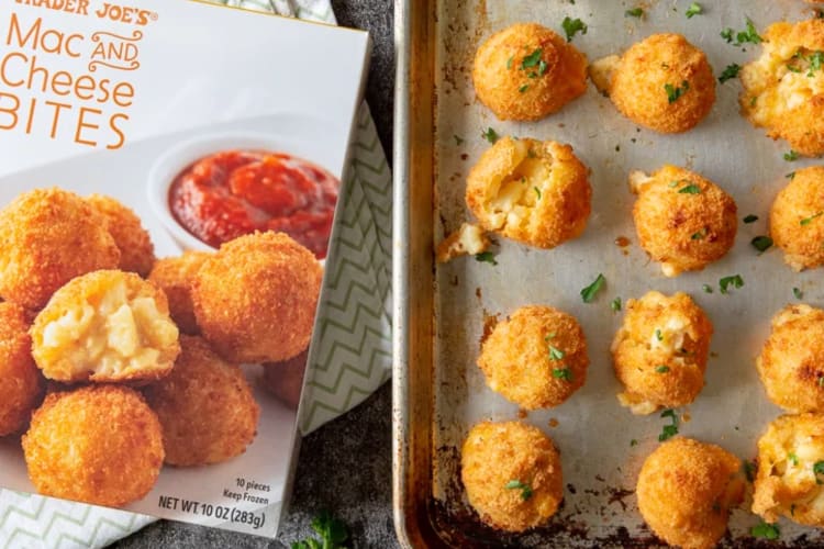 Mac and cheese balls on a tray next to the box they came in