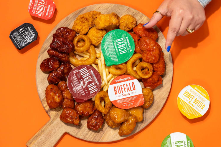 A selection of fried foods and sauces on a table