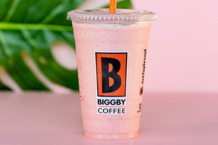 A pink smoothie on a pink counter