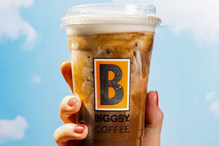 An iced coffee drink with cold foam top