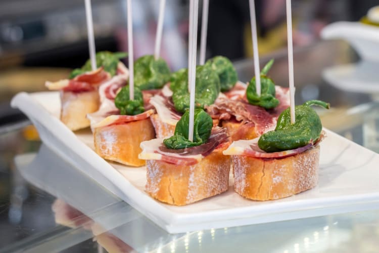 Meat and bread with skewers on a plate