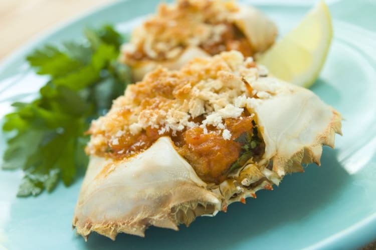 Stuffed crab shells on a plate