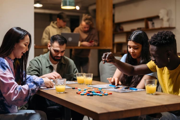 Playing games at a board game cafe is a fun doube date idea in Birmingham, UK