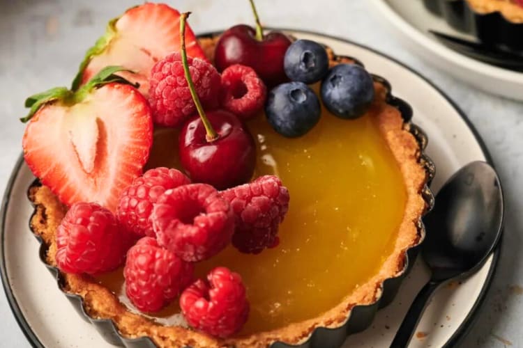 A lemon tart with fruit