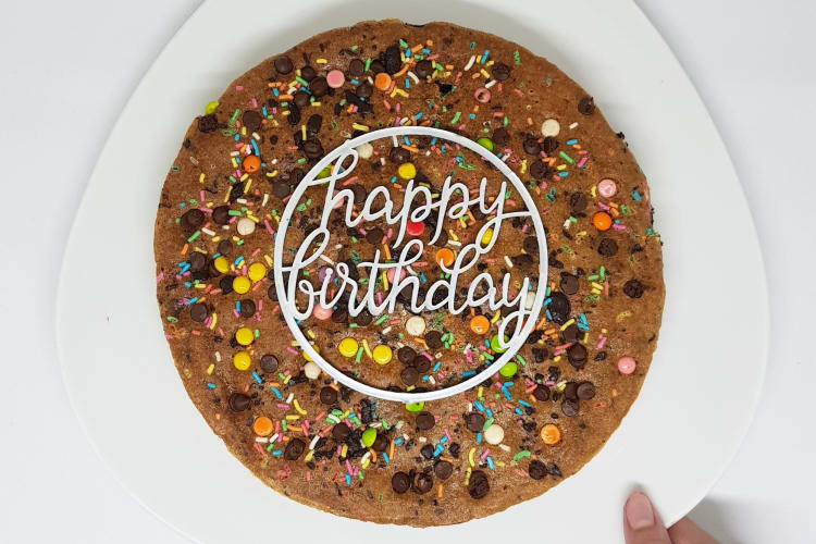 A large cookie with birthday decorations