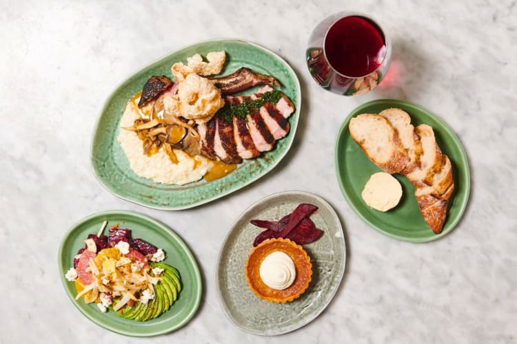 A selection of dishes and wine on a table