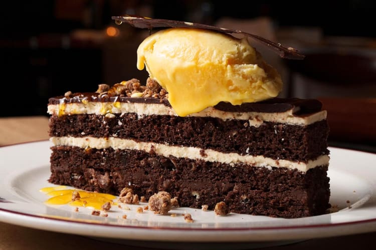 A chocolate dessert on a white plate