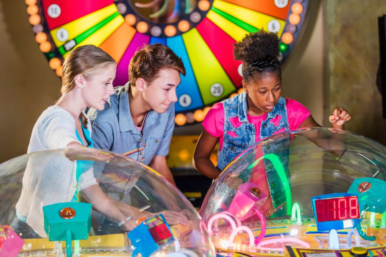 Kids playing arcade games