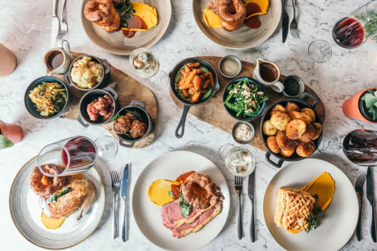 Sunday roast dishes on a table
