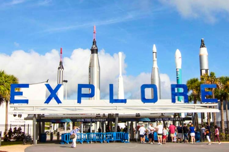 The entrance to a venue with a blue Explore sign