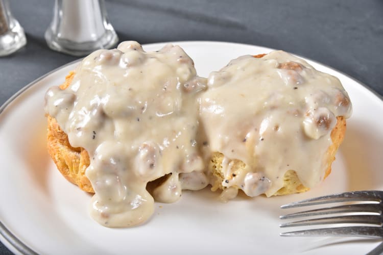 Two biscuits covered in gravy