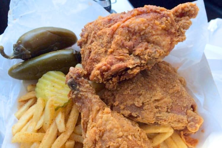 Fried chicken, fries, pickles and hot peppers