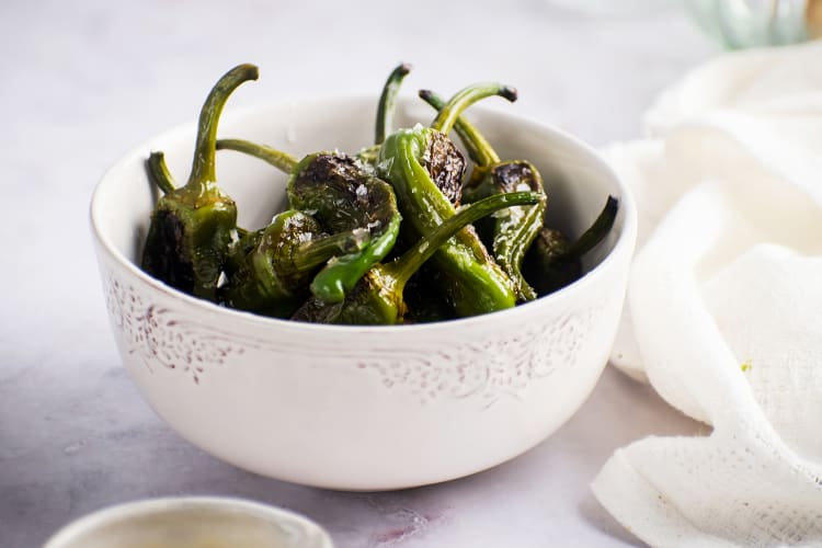 blistered shishito peppers are a quick vegan appetizer