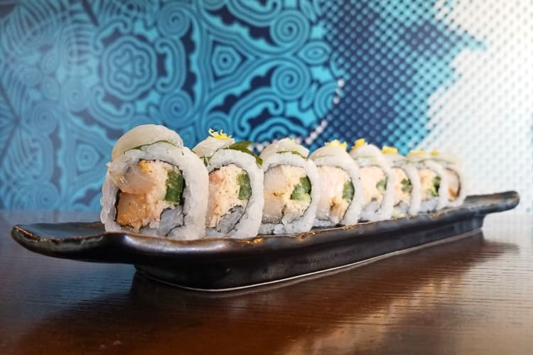 Eye-level shot of eight pieces of sushi from Blue Sushi Sake Grill