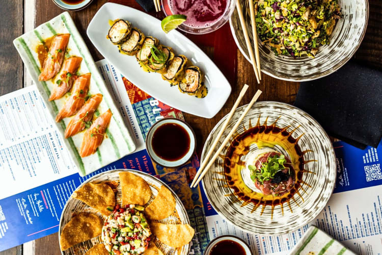 Aerial shot of a variety of meals from Blue Sushi Sake Grill