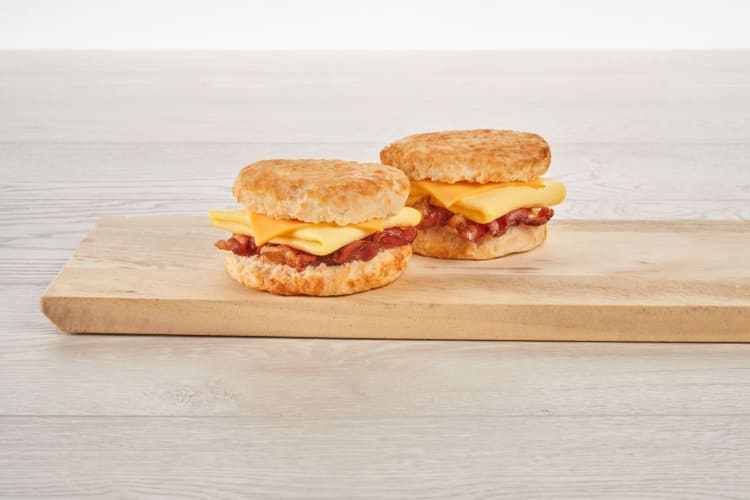 Two Bojangles breakfast biscuits filled with bacon, egg and cheese.