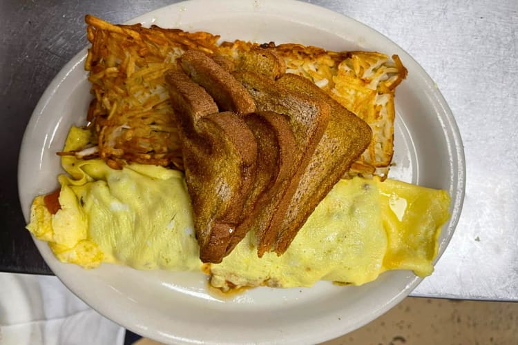 Breakfast meal with an omelette, cheese and toast from Bread and Butter Café