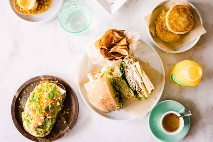 An aerial view of breakfast dishes and drinks on a table