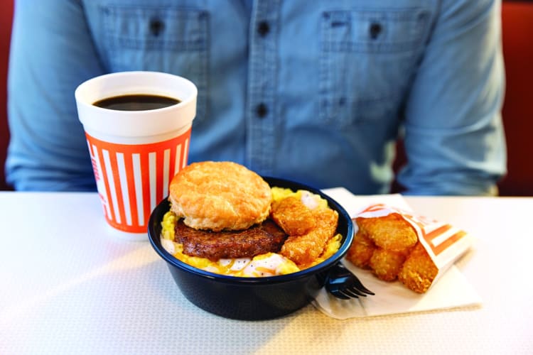 A coffee, breakfast bowl and a packet of hash browns from the Whataburger breakfast menu
