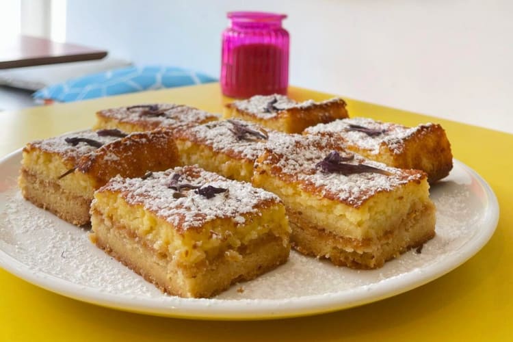 A plate with multiple pieces of sponge cake on it